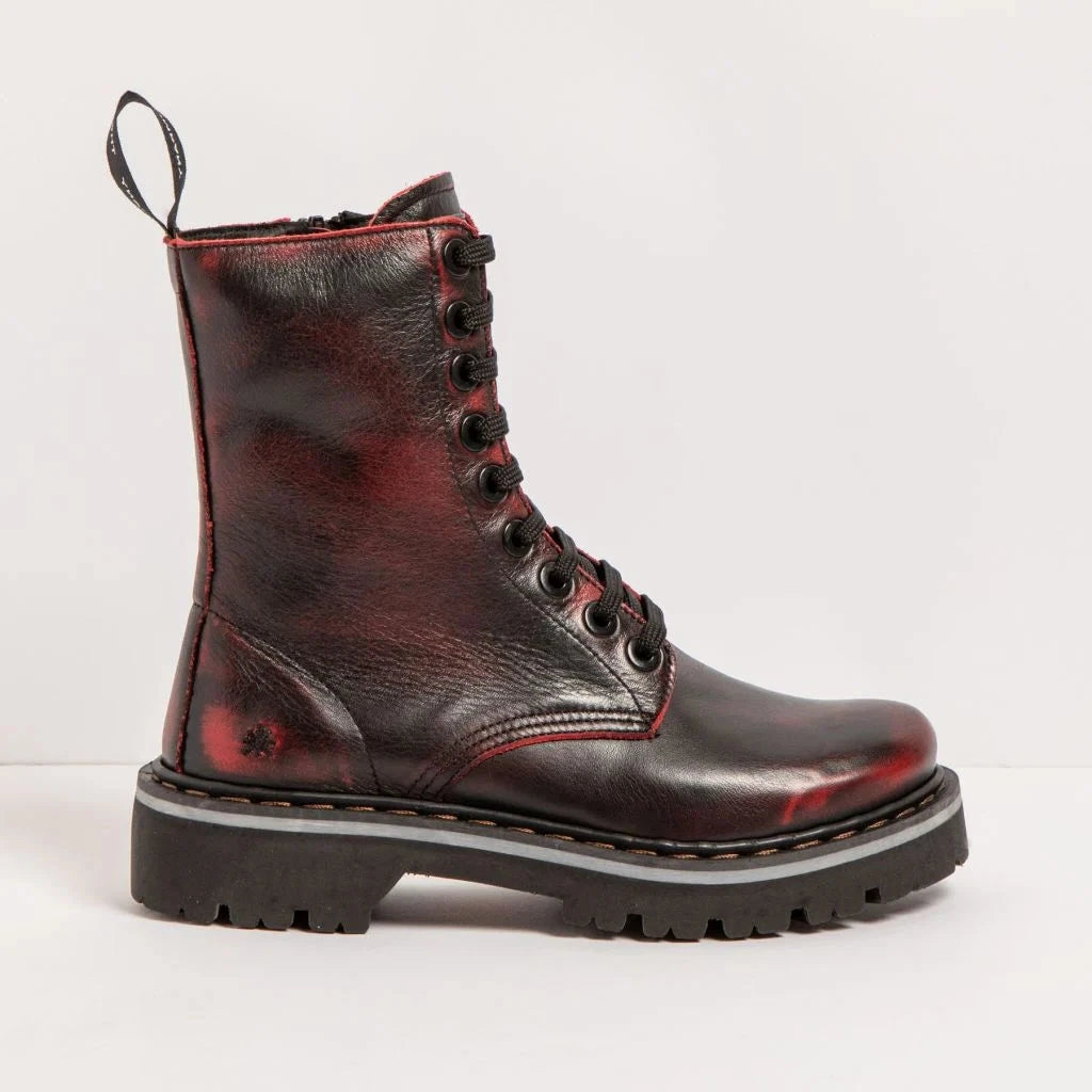 A single lace-up combat boot in distressed dark red and black leather with a thick black lug sole, shown in a side profile against a clean white studio background.